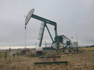 One of two pumpjacks waiting for teardown and transportation to its new home